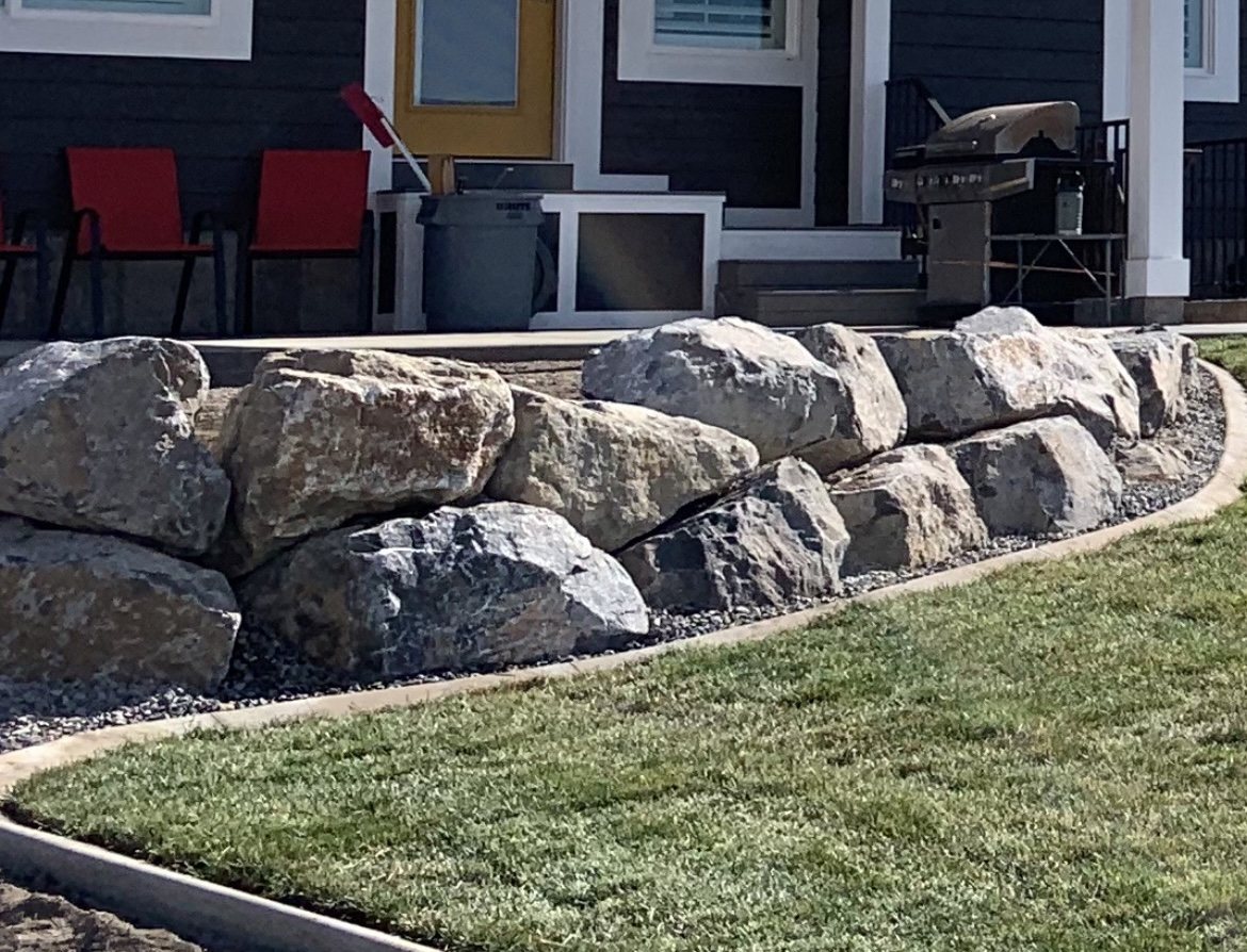 Boulder retaining wall built by Summit Contracting