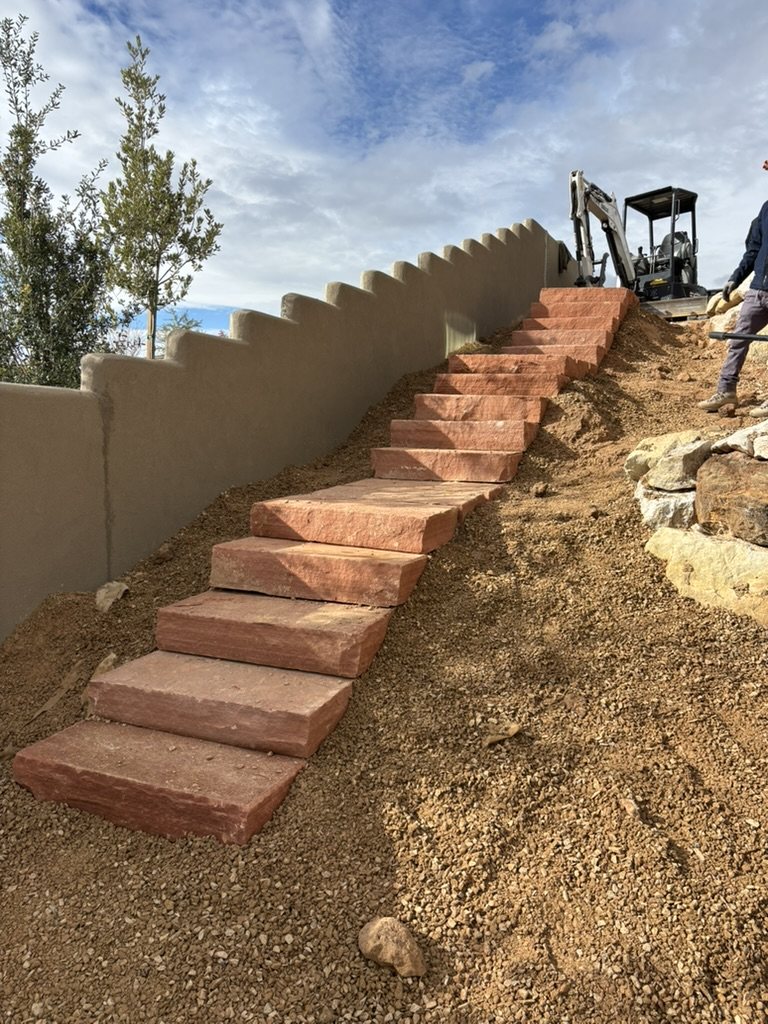 Long natural stone staircase installed on a slope